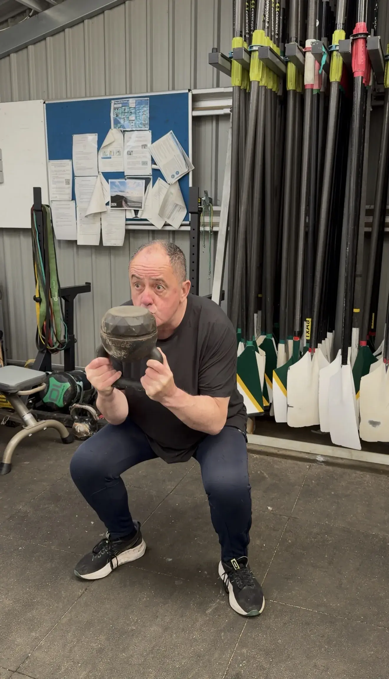 A client training with a kettlebell