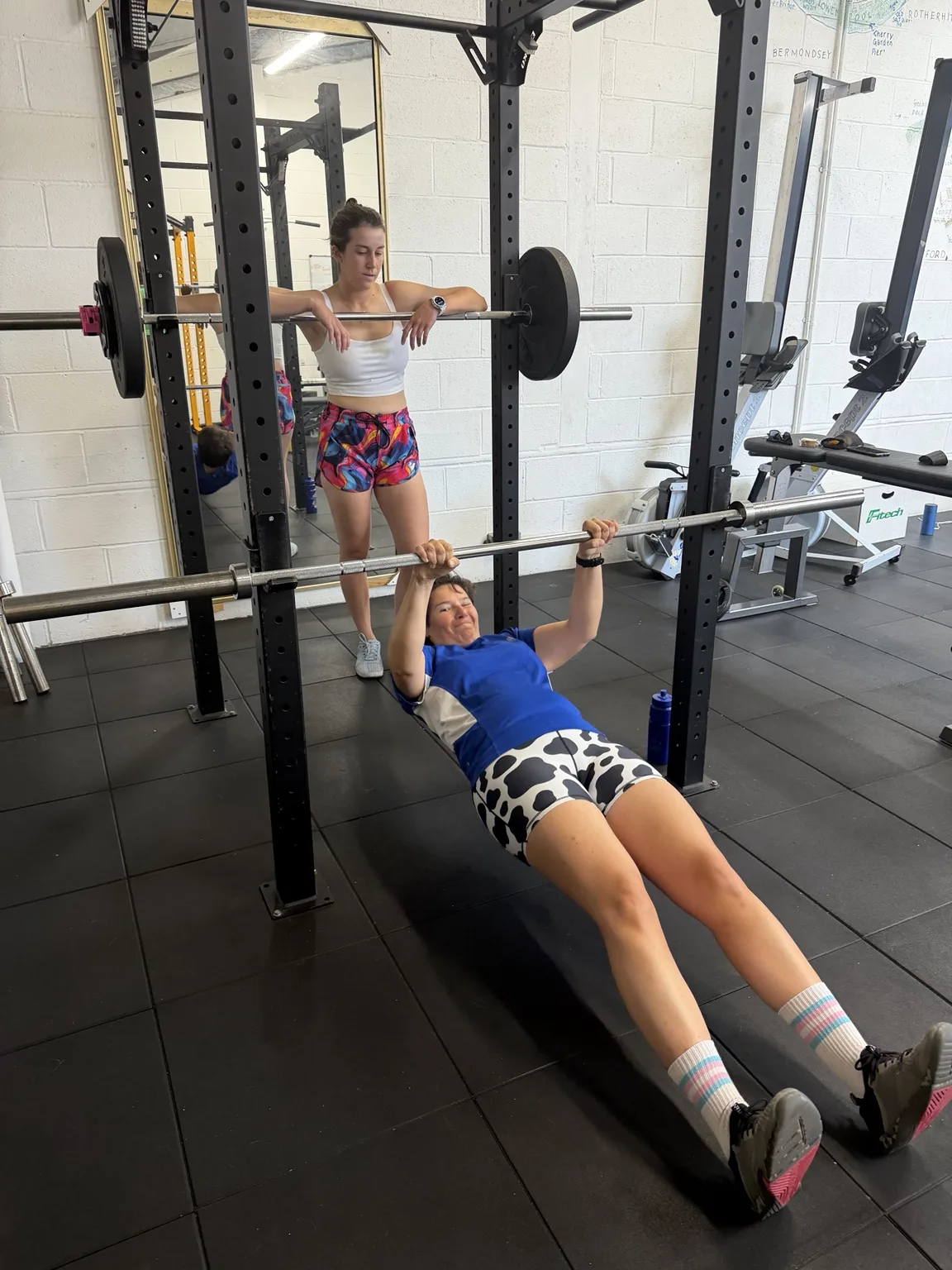 Client training with free weights during a coached session