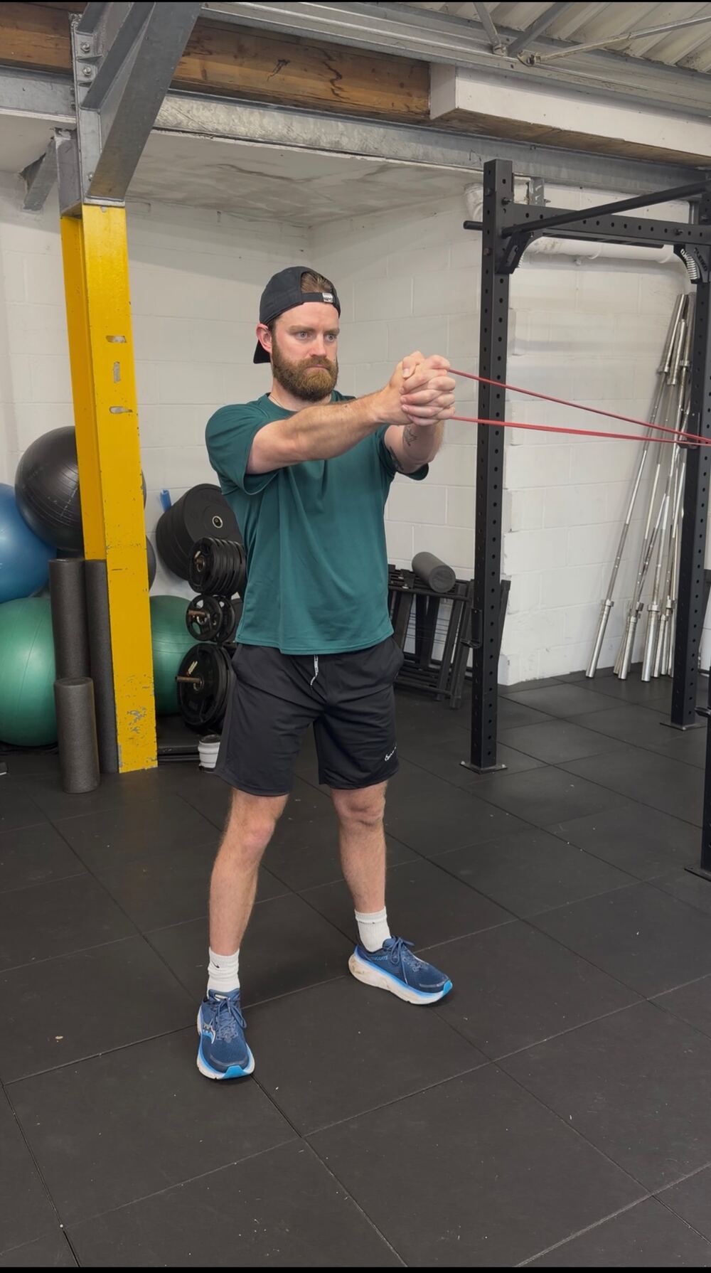 Client performing a banded anti-rotation press in the Greenwich studio